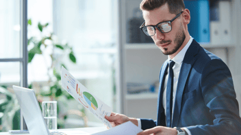 man organizing financial documents